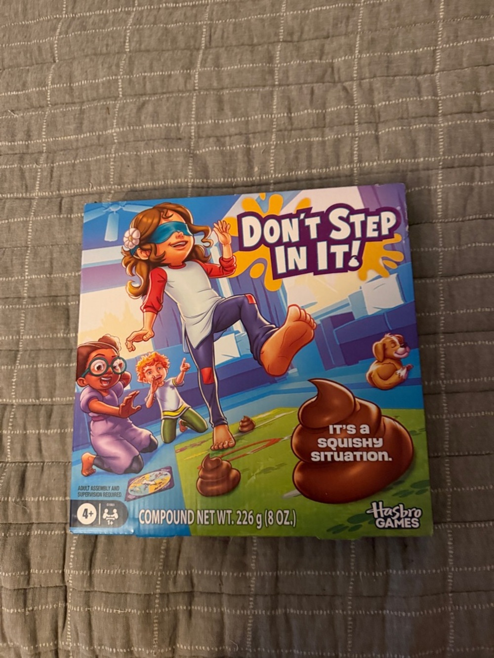 Don’t Step In It! Family Board Game – Purple/Blue Box